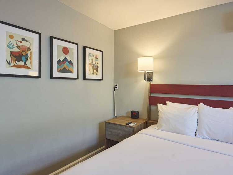 three pillows and artwork