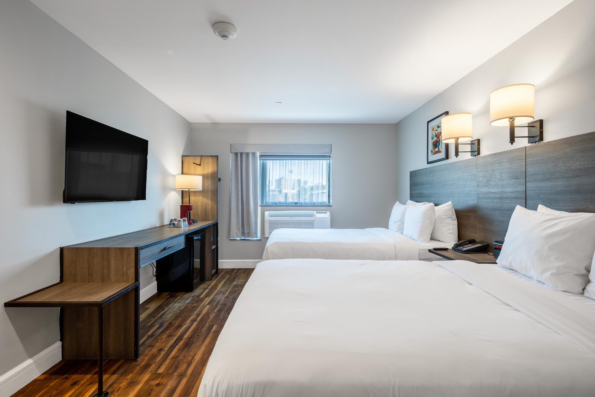 Two beds and tv in hotel room