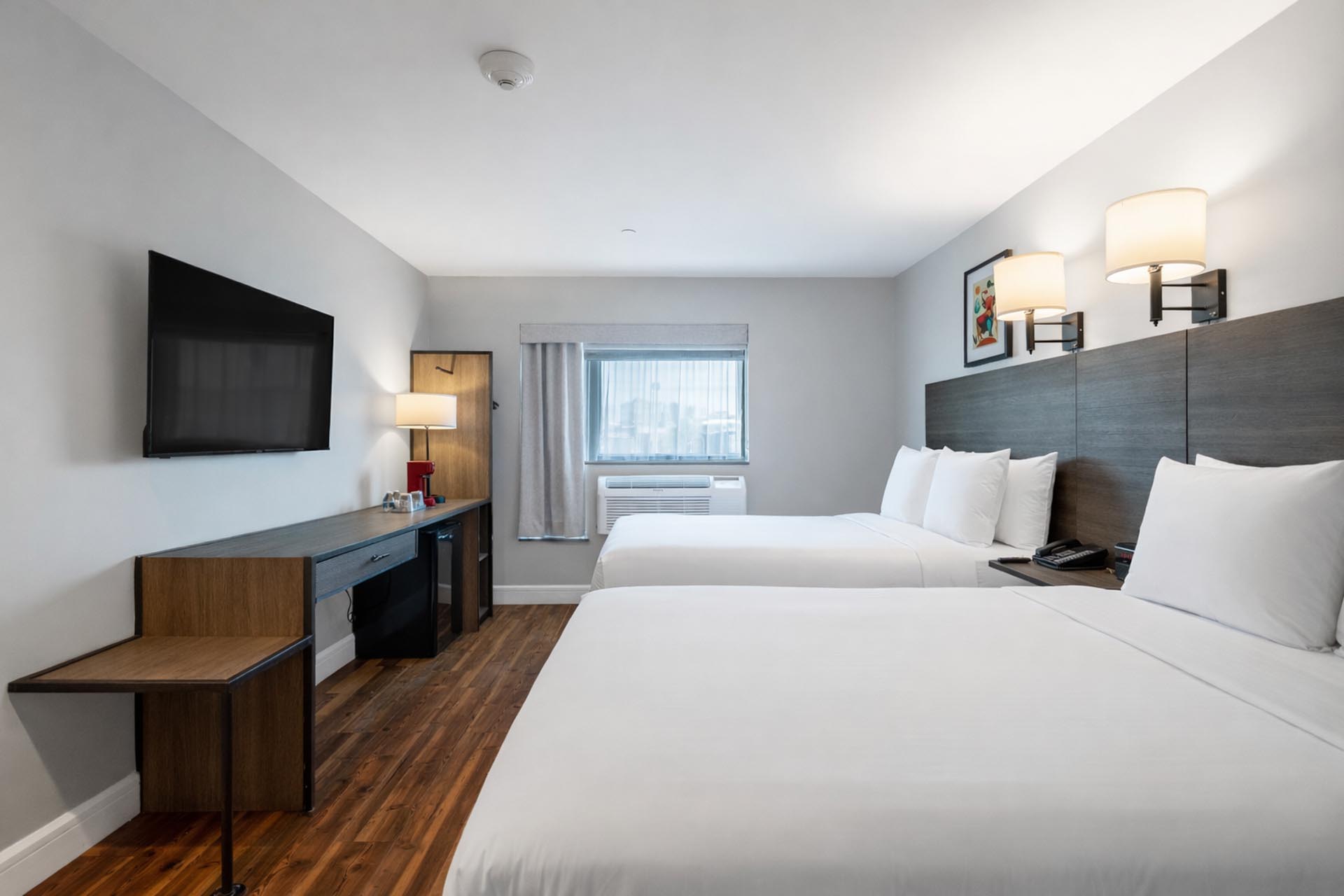 Two beds and tv in hotel room